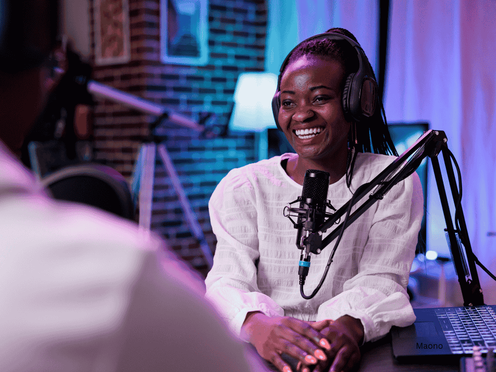 Female podcaster interviewing a guest using an XLR microphone