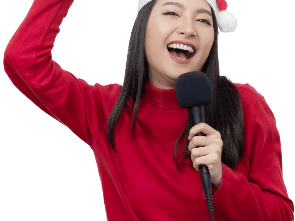 A woman in Christmas costume singing using a cardioid pattern microphone