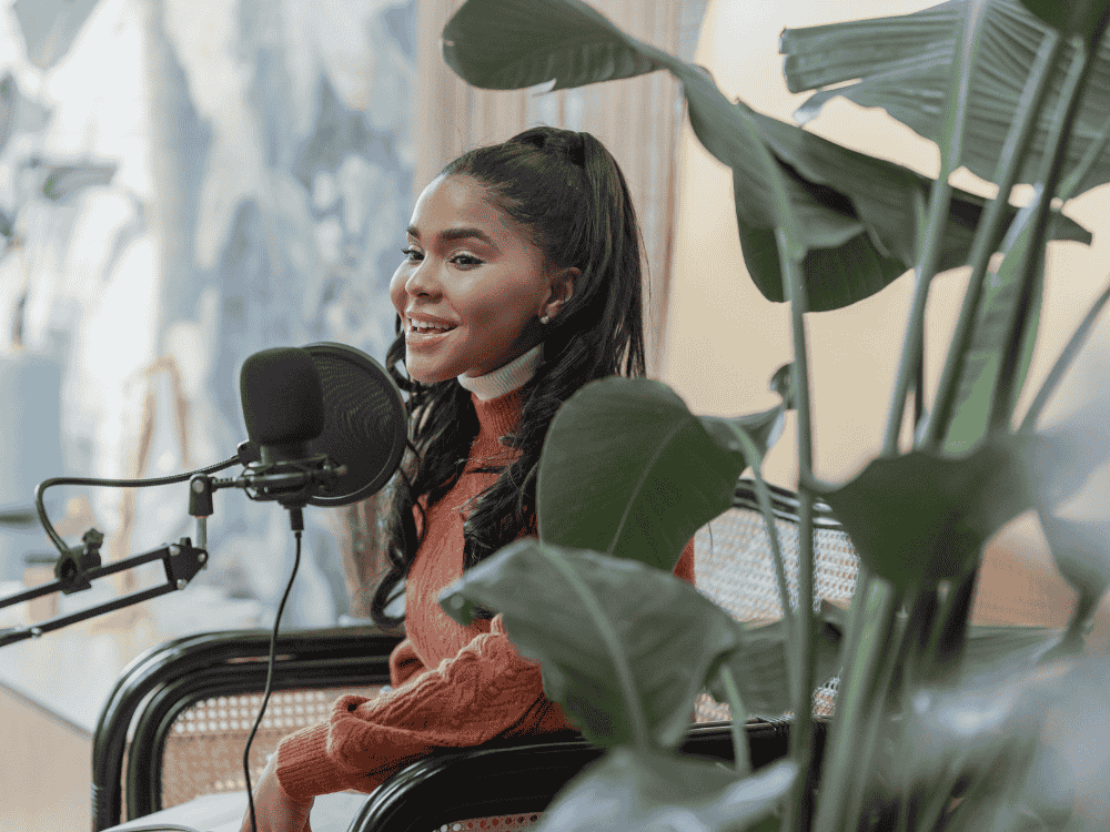 A lady singing using a condenser microphone for her Christmas content