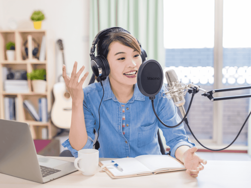 A woman doing a podcast in her home studio