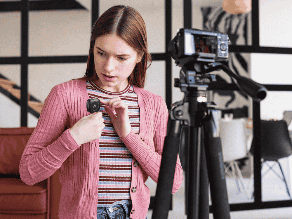 A lady preparing for an interview production using a wireless Lavalier microphone