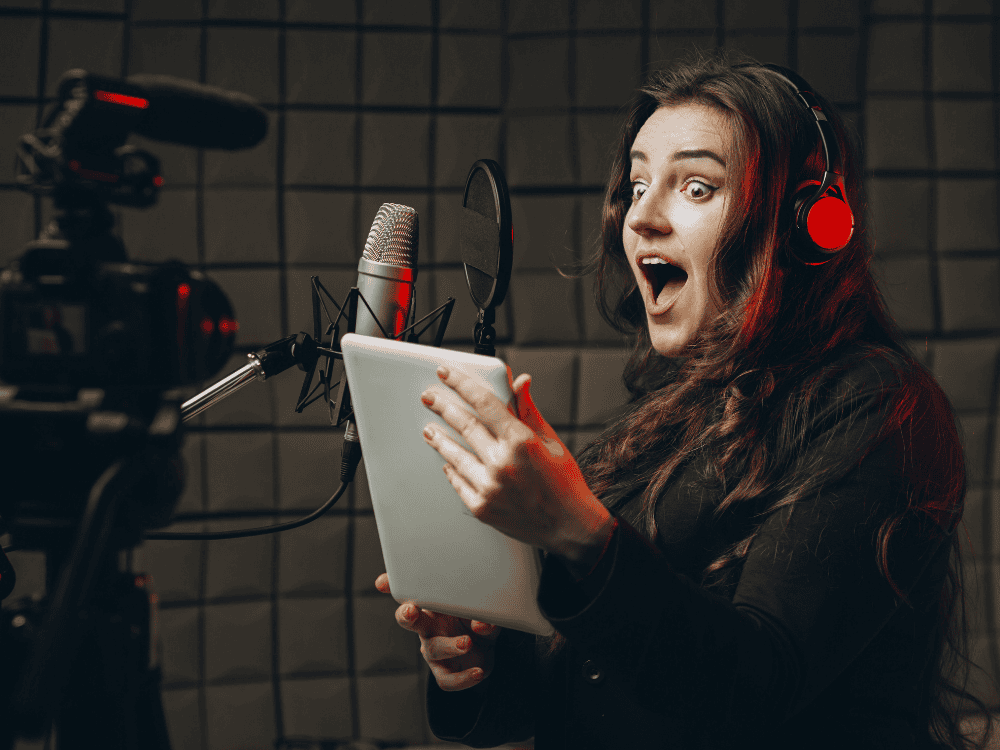 A voice artist using a voice acting microphone