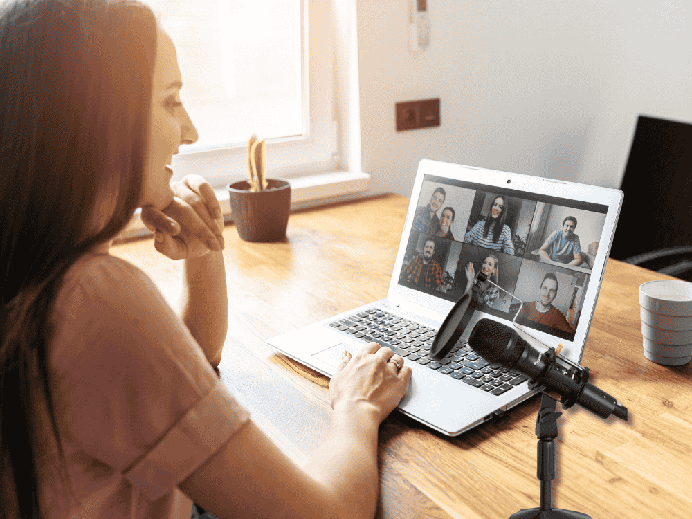 A lady working from home taking video calls with colleagues using a Maono best dynamic vocal mic 