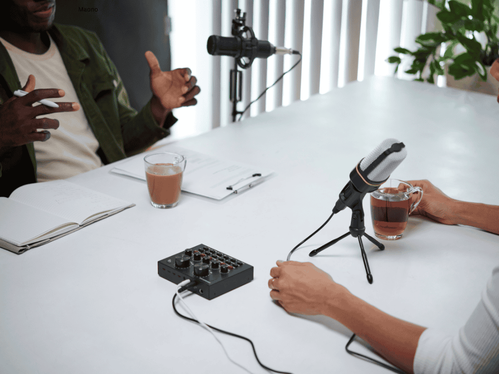 Podcasters using a podcast microphone kit