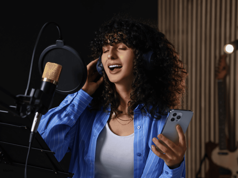 A lady performing vocals using a USB microphone for singing