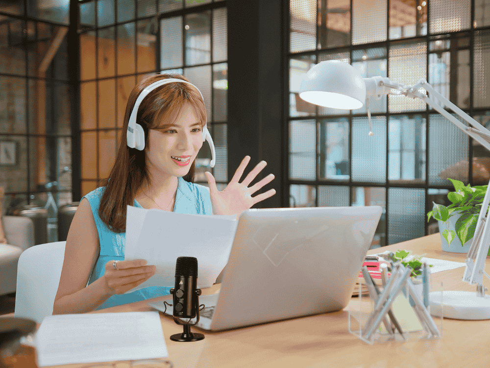 A lady remote working using a condenser microphone for video call