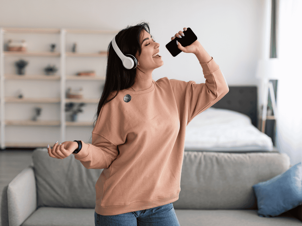 A lady live streaming using a wireless microphone