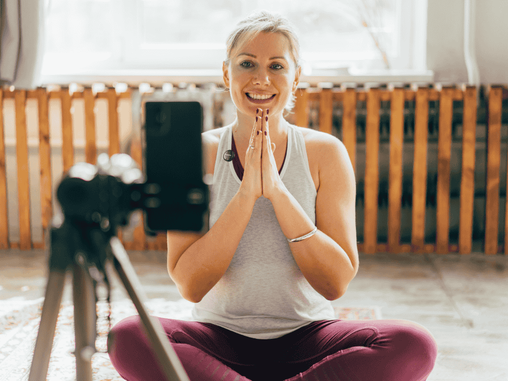 A fitness instructor communicating with a wireless microphone in class