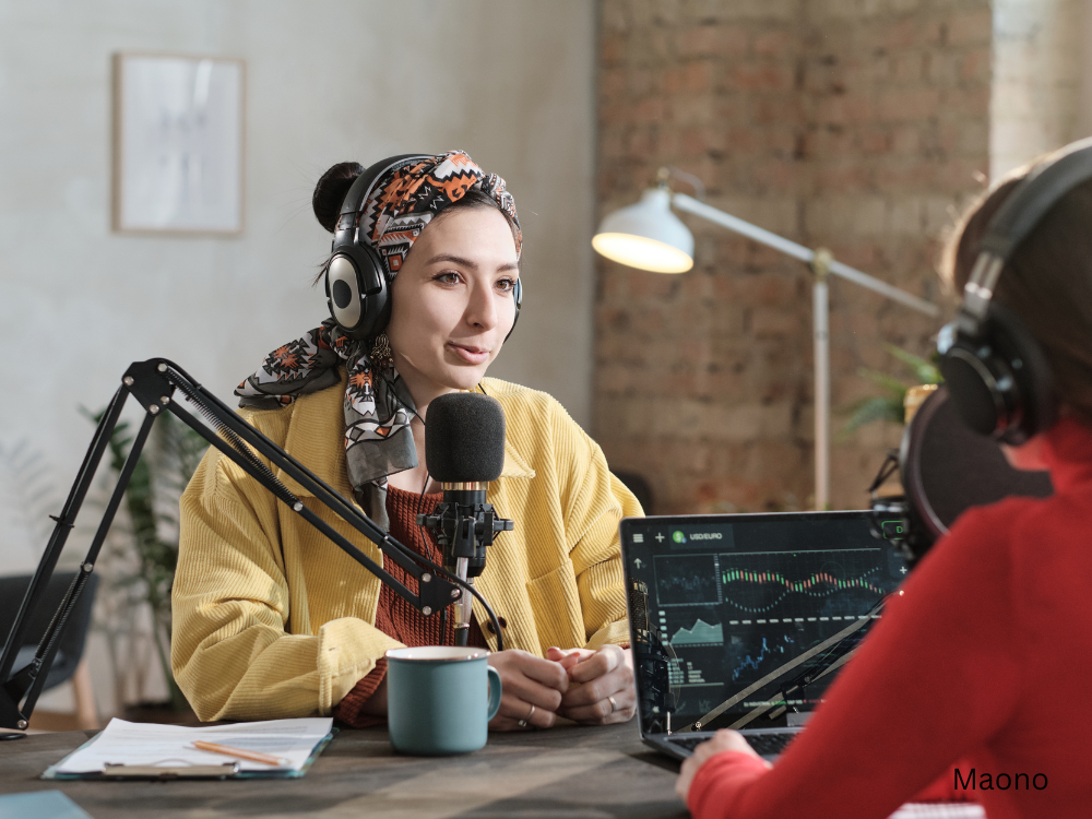 2 females podcasting using a USB mic