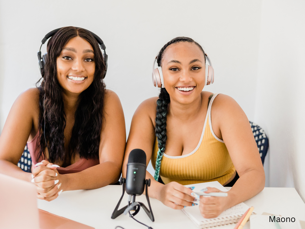 2 women podcasting using a mic with microphone stand