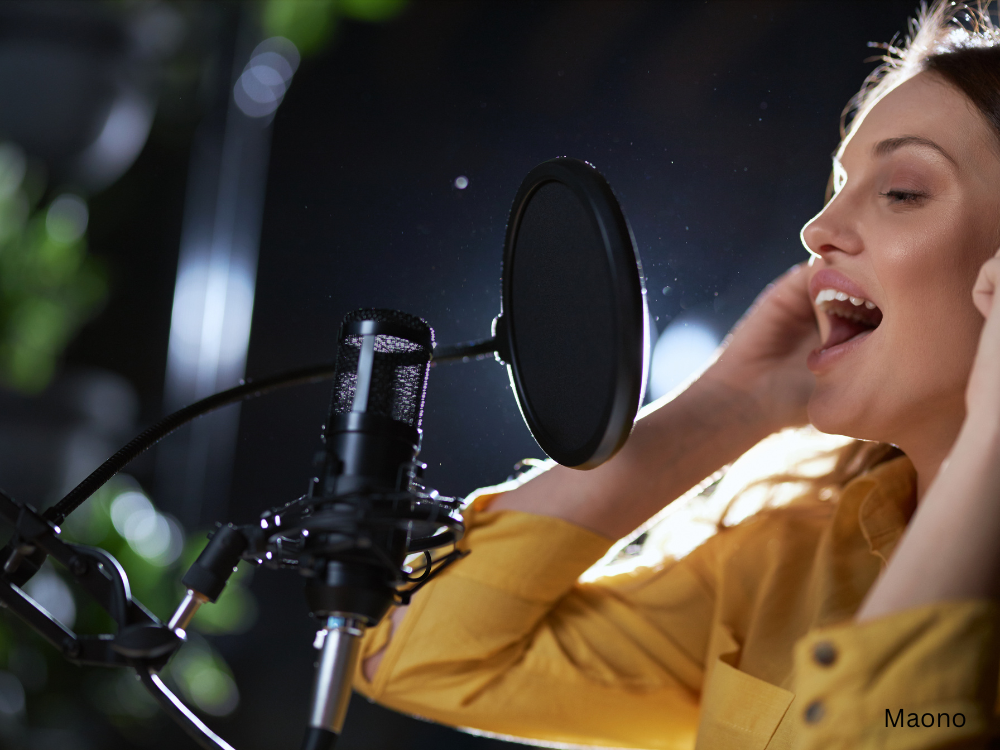 female singing in a studio using XLR microphone