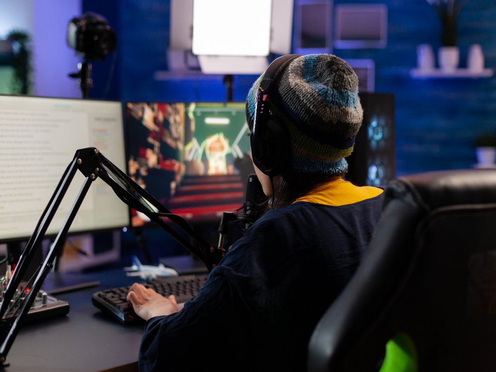 girl game streaming using a gaming microphone