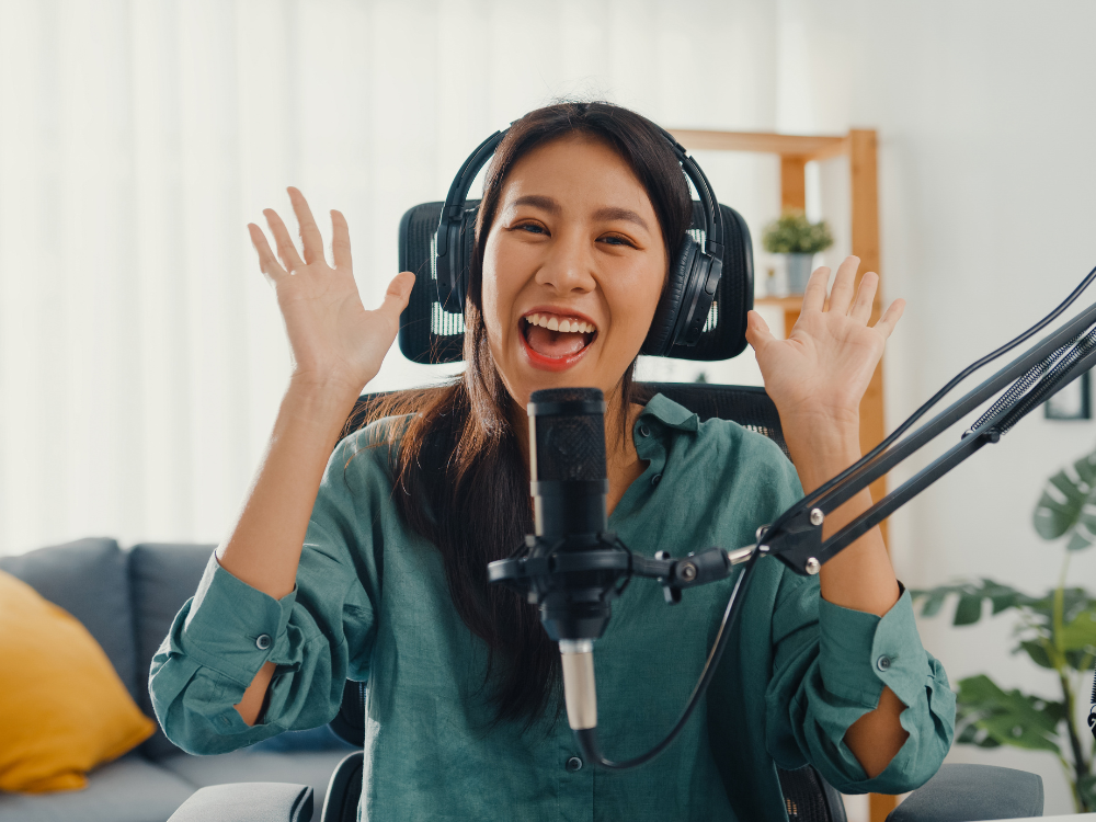  girl podcasting with headphone and microphone