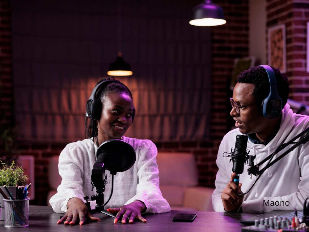 male and female recording a podcast using a podcast kit