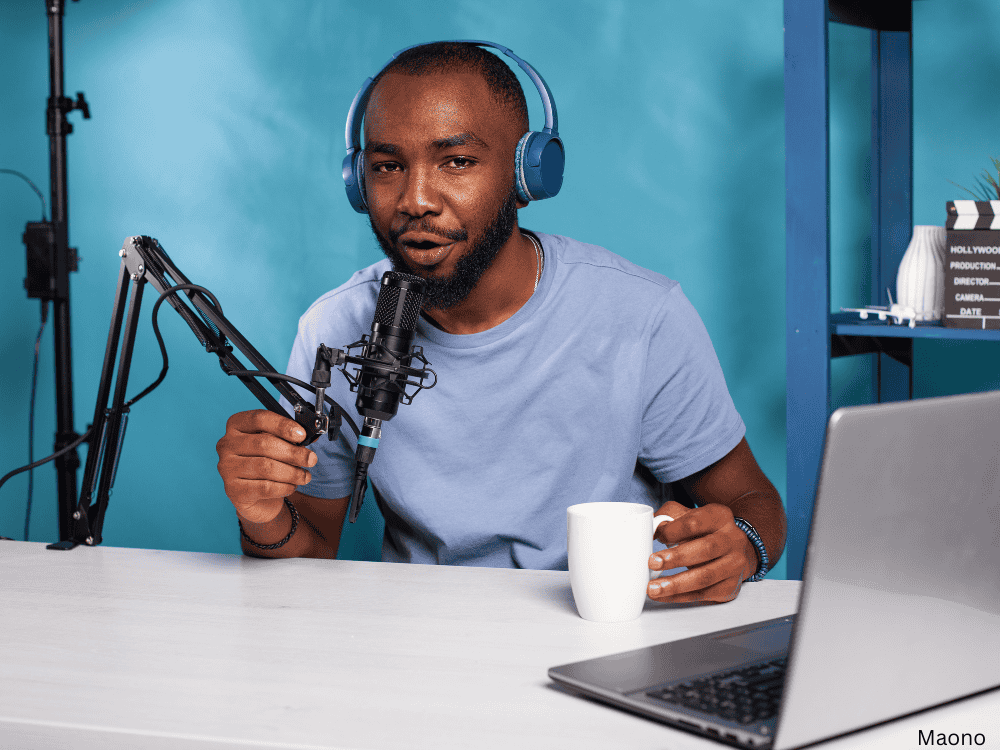 a male podcaster using a microphone stand with boom arm 