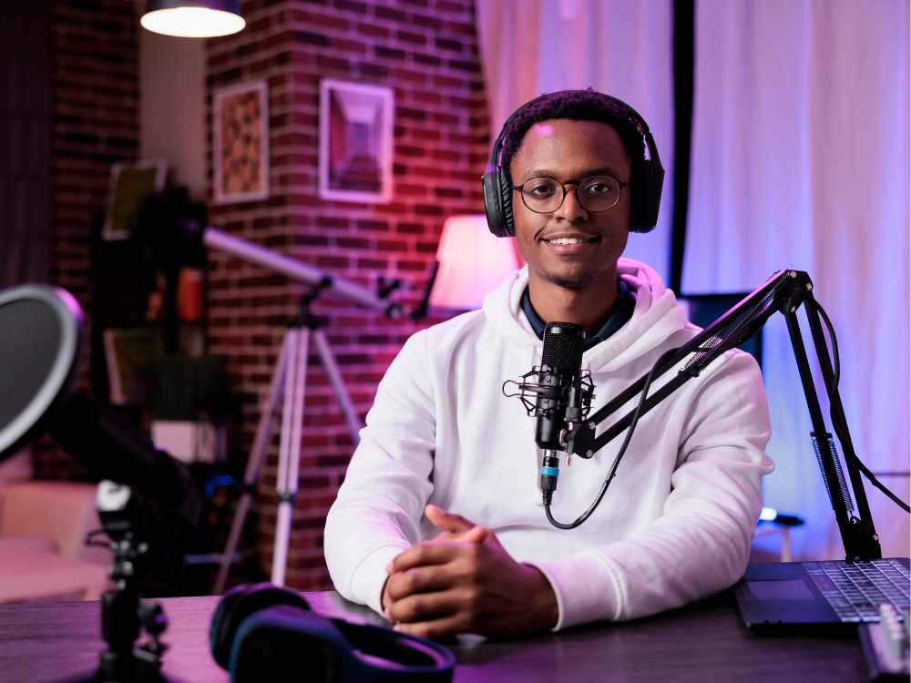 male podcasting using a boom arm mic stand