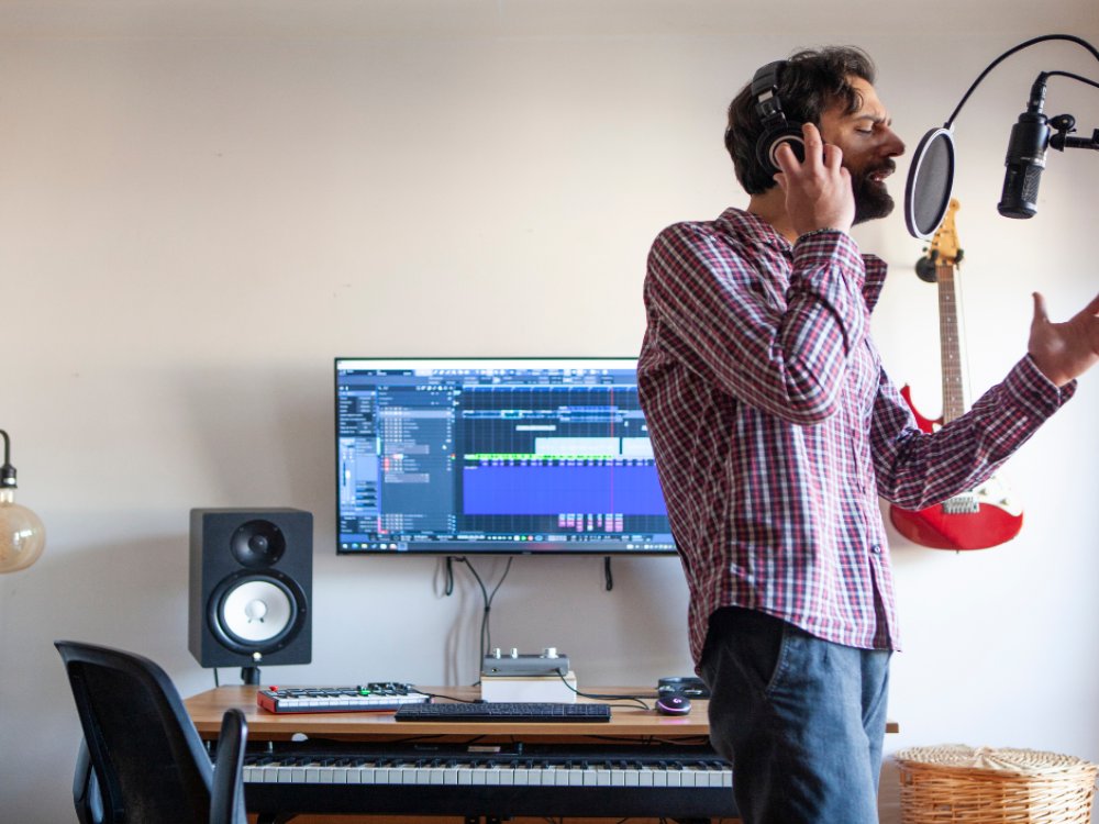 man singing in home studio