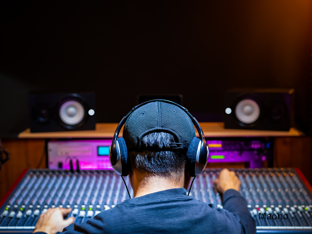 man using an audio mixer