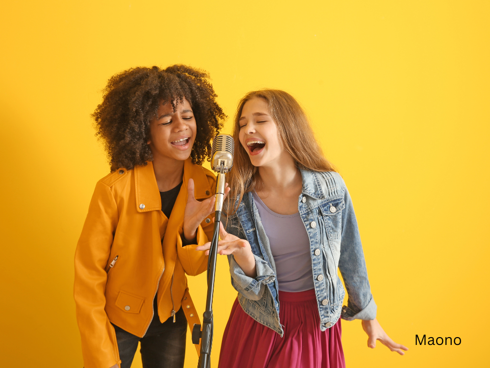 teenage girls singing using a microphone