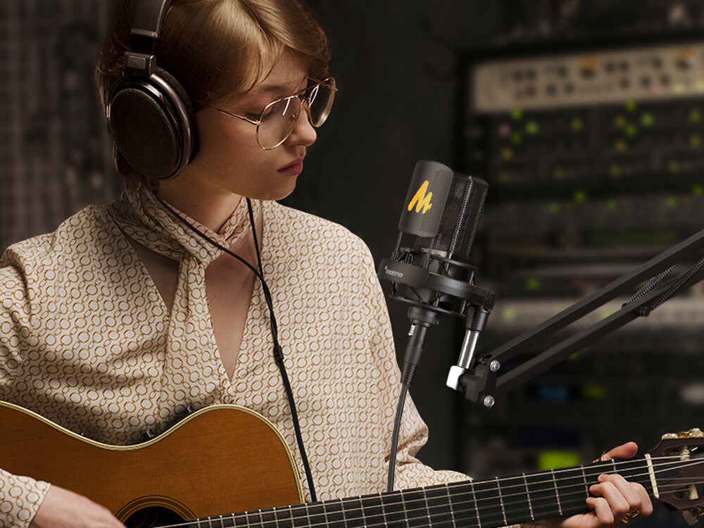 girl playing guitar with one of the good recording vocals mic in 2025