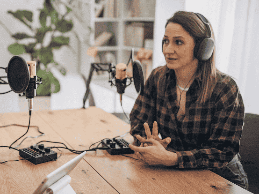 woman interviewing using a podcast equipment